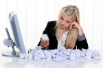 woman surrounded by crumpled paper (Image by ginasanders)